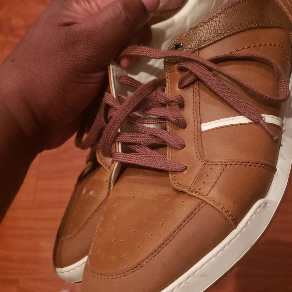 A pair of Aldo sneakers